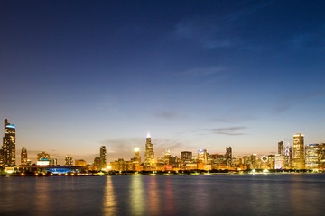 Beautiful view of Chicago skyline with waterfront at night, Illinois, USA