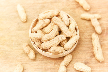 A pile of peanuts in a bamboo basket