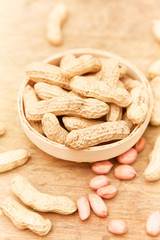 A pile of peanuts in a bamboo basket