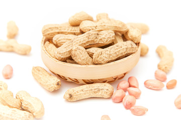 A pile of peanuts in a bamboo basket