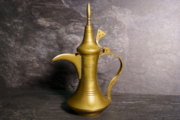 Fototapeta na wymiar Copper kettle on a dark background.