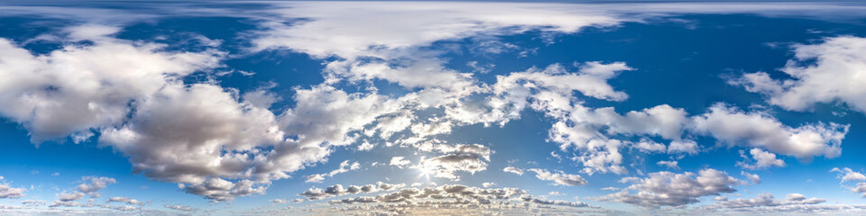 Seamless hdri panorama 360 degrees angle view blue sky with beautiful cumulus clouds with zenith for use in 3d graphics or game development as sky dome or edit drone shot