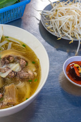 Vertical photo of noodle soup on the table