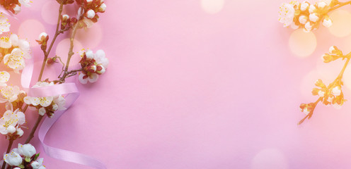 Fototapeta na wymiar Art Amazing spring blossom; Beautiful cherry tree tender flowers on pink background.