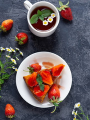 Summer delicious Breakfast a Cup of tea and strawberry pie on the table