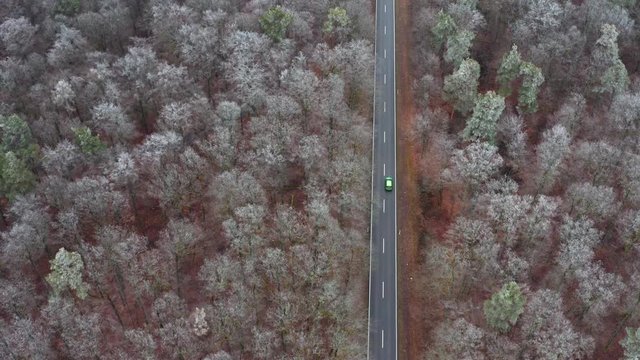 Aerial view of road through forest in winter, Steigerwald, Germany