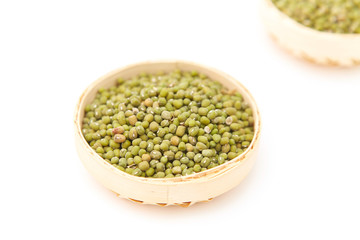 A pile of green beans in the bamboo basket