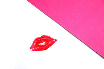 Drawing with red lipstick. Kiss. Beautiful designer cosmetics background.