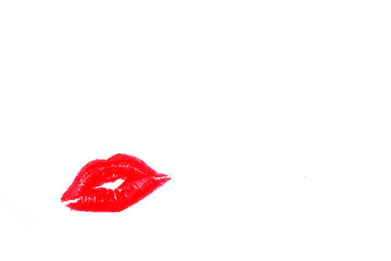 Drawing with red lipstick. Kiss. Beautiful designer cosmetics background.