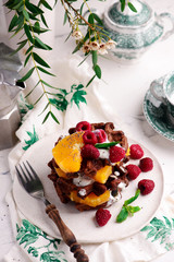 Obraz na płótnie Canvas Vegan waffles with fresh fruits.selective focus.