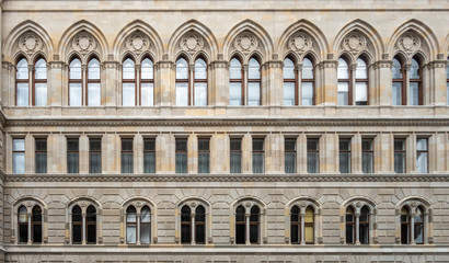 Fototapeta na wymiar Facade of a building with a symmetrical pattern of windows