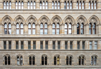 Fototapeta premium Facade of a building with a symmetrical pattern of windows