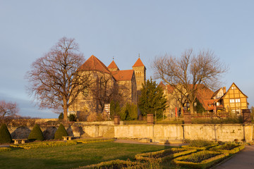 The church St. Servatii on the castle mountain in Quedlinburg, Germany in golden morning sunlight