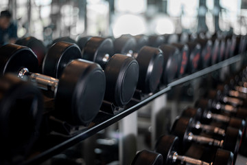 Fototapeta na wymiar row of dumbbell in fitness gym