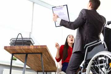 Man in suit got up from wheelchair, girl in shock. Communicate correctly with others and deal with sad thoughts. Behave correctly in different situations. Achieve what is supposed to be