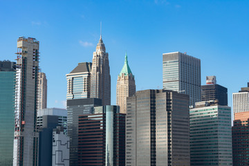 Fototapeta na wymiar Lower Manhattan New York City Skyline Scene with Modern Skyscrapers on a Clear Blue Day
