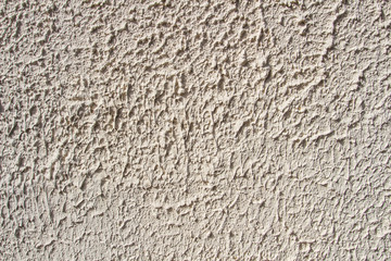 Textures and background, rippled, uneven wall of a house