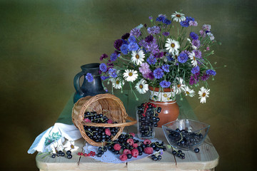 Still life with wildflowers and black currant