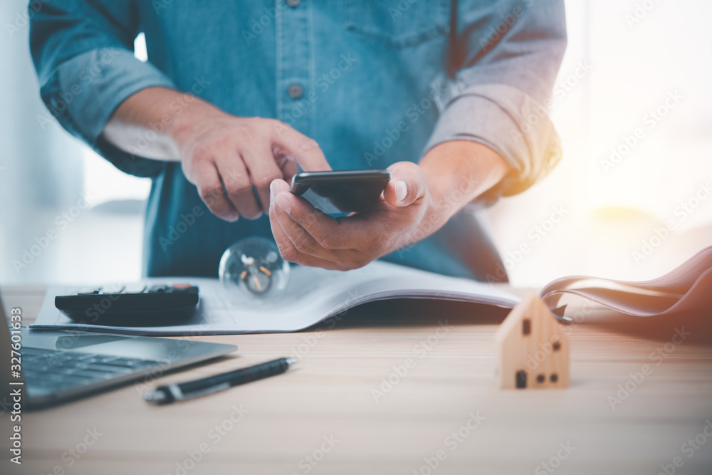 Aufkleber Hand man using smart phone for Searching Browsing Internet Data Information Networking Concept.Find information about building a house.