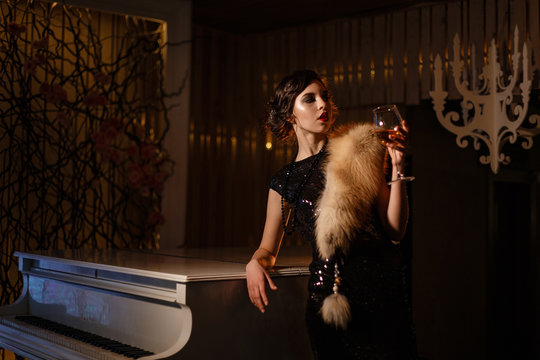 Portrait of 20s style festive beauty in a restaurant