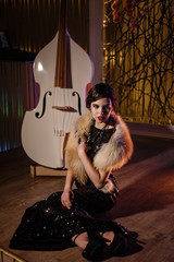 Portrait of 20s style festive beauty in a restaurant