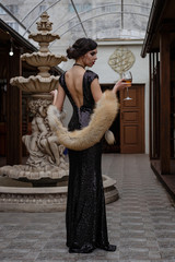 Portrait of 20s style festive beauty in a restaurant