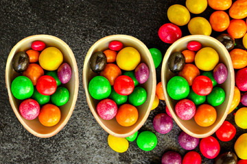 Fototapeta na wymiar chocolate egg and candy easter decor, menu concept background. top view. copy space
