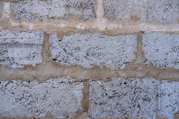 Carelessly laid cement blocks by an inexperienced craftsman with a violation of the laying technology.