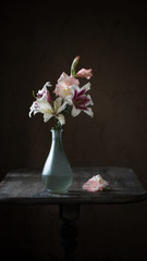 still life with summer flowers in vase on dark background