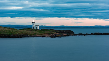 Elie cloudy sunset with lighthouse 