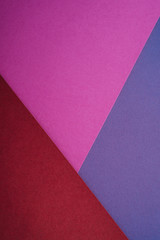 Paper triangle geometric texture in red, purple and blue colors