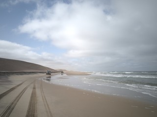 Fototapeta na wymiar 4x4 Cars driving by the beach