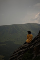 silhouette of woman on top of mountain