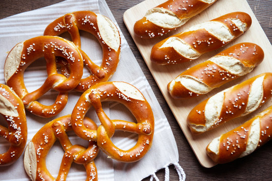 Closeup photo of lye bun and bavarian pretzel in bakery