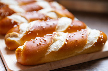 Closeup photo of lye bun and bavarian pretzel in bakery