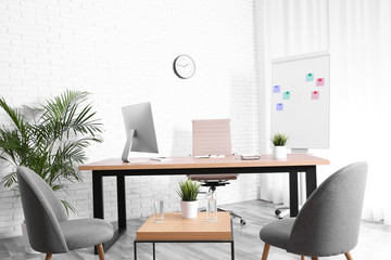 Fototapeta premium Interior of modern office with table, chairs and computer
