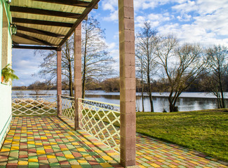 Beautiful wooden villa with a green patio. Minsk, Belarus - March 01 2020