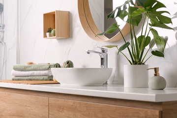 Stylish vessel sink on light countertop in modern bathroom - obrazy, fototapety, plakaty
