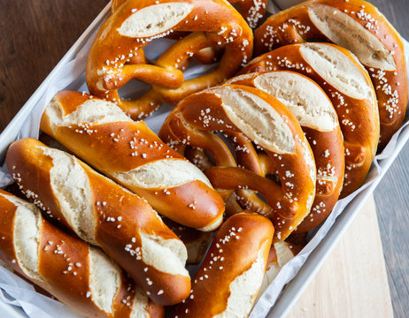 Closeup photo of lye bun and bavarian pretzel in bakery