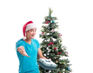 Young man decorating christmas tree isolated on white