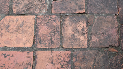 Fototapeta premium Texture of rectangle weathered brick pavement.