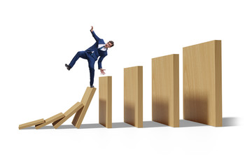 Businessman in domino effect concept