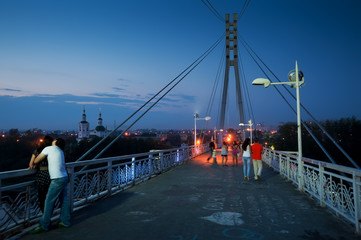 Lovers bridge in dusk time. Tyumen. Russia