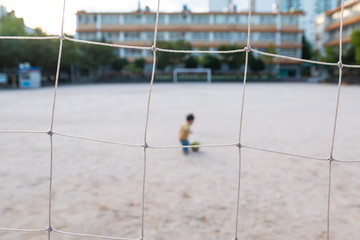 Asian cute baby play with soccer ball alone