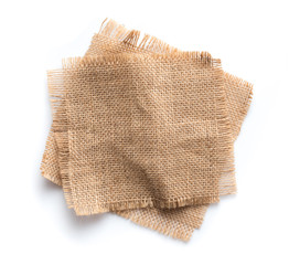 Fototapeta na wymiar Old burlap fabric napkin, sackcloth piece isolated on white background