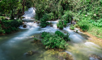 Cao Bang / Guangxi, Vietnam and China landscape.  Emerald green river stream of Song Quay Son river, border of Northern Vietnam and China. Close to Ban Gioc and Detian waterfall. 