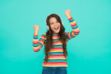 Melody to cheer up. Energetic rhythm concept. Good track improves mood. Happy small girl listen...