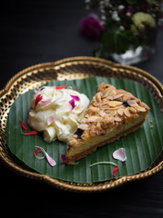 Piece of peanut cheesecake on wooden table