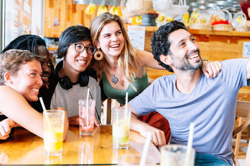 multiethnic youth group takes a selfie drinking natural juice, healthy food