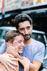 young couple, the boy consoles and protects his girlfriend